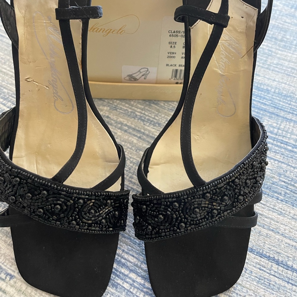 Michaelangelo Black Beaded Pumps.
8 1/2.. worn only once. Pet/smoke free home..